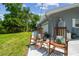 Inviting patio with rocking chairs creates a relaxing outdoor retreat at 10301 Nina Ct, New Port Richey, FL 34654