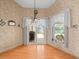 Dining area features wood flooring and a sliding door leading to the pool area at 10442 Ventura Dr, Spring Hill, FL 34608