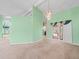 Open-concept living room with decorative lighting, and easy access to outdoor space at 10442 Ventura Dr, Spring Hill, FL 34608