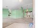 Bright living room featuring an open floor plan, neutral carpeting and sliding door access to the backyard at 10442 Ventura Dr, Spring Hill, FL 34608