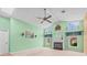 Bright living room with a cozy fireplace and ample natural light from multiple windows at 10442 Ventura Dr, Spring Hill, FL 34608