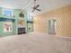 Large living room with a unique textured wall, fireplace, and lots of natural light at 10442 Ventura Dr, Spring Hill, FL 34608