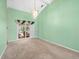 Bright living room with sliding glass doors to the pool and neutral carpeting at 10442 Ventura Dr, Spring Hill, FL 34608