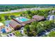An aerial view of the YMCA facility showing its outdoor pool, playground, and extensive parking area at 1049 Larkin Rd, Spring Hill, FL 34608