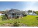Backyard showcasing a screened-in pool, patio area, and well-maintained lawn at 1049 Larkin Rd, Spring Hill, FL 34608