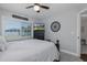 Comfortable bedroom featuring a ceiling fan, black dresser, and window views at 1049 Larkin Rd, Spring Hill, FL 34608