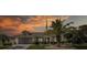 Beautiful one-story home with a well-maintained lawn, complemented by a prominent palm tree and a two-car garage at 1049 Larkin Rd, Spring Hill, FL 34608