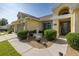 Inviting home entrance featuring a decorative fountain, manicured bushes, and charming walkway at 1049 Larkin Rd, Spring Hill, FL 34608