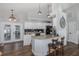 Well-lit kitchen features granite countertops, white cabinetry and stainless steel appliances at 1049 Larkin Rd, Spring Hill, FL 34608