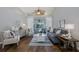 Bright living room with hardwood floors, neutral decor, and sliding glass doors at 1049 Larkin Rd, Spring Hill, FL 34608