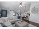 Bright living room with neutral colors that connects to kitchen and dining area at 1049 Larkin Rd, Spring Hill, FL 34608
