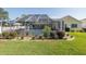 Enjoy the screened-in pool area with ample seating and lush landscaping at 1049 Larkin Rd, Spring Hill, FL 34608