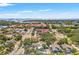 Aerial view showcases neighborhood, cityscape, and coastline with beautiful waterways at 1115 Pennsylvania Ave, Palm Harbor, FL 34683