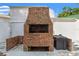 Exterior brick grill and cooking area, ideal for outdoor entertaining at 1115 Pennsylvania Ave, Palm Harbor, FL 34683