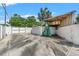 View of gated driveway with garage and storage at 1115 Pennsylvania Ave, Palm Harbor, FL 34683
