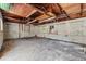 Interior view of garage space with unfinished walls at 1115 Pennsylvania Ave, Palm Harbor, FL 34683