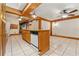 Spacious kitchen features a center island, wood accents, and tiled floors at 1115 Pennsylvania Ave, Palm Harbor, FL 34683