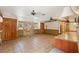 Large open living area with tile flooring, stone accent wall, and natural wood trim at 1115 Pennsylvania Ave, Palm Harbor, FL 34683