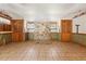 Open living area featuring tile floors, a decorative stone wall, and wood-framed doors at 1115 Pennsylvania Ave, Palm Harbor, FL 34683