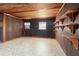 Living space with a wood ceiling and wood paneled walls at 1115 Pennsylvania Ave, Palm Harbor, FL 34683