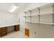 Small room with built-in desk and shelving at 1115 Pennsylvania Ave, Palm Harbor, FL 34683