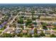 Aerial view showing the location of the home within a quiet residential neighborhood with mature trees at 11192 Archer Ave, Spring Hill, FL 34608