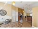 View of the dining room and kitchen areas showing stainless steel appliances and modern finishes at 11192 Archer Ave, Spring Hill, FL 34608