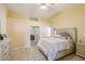 Serene main bedroom with vaulted ceiling, light-colored walls, and an ensuite bathroom at 11192 Archer Ave, Spring Hill, FL 34608