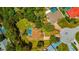 Aerial view of the property showcasing the pool, large backyard, and neighborhood at 11291 Countrywood Ct, Spring Hill, FL 34609