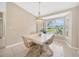 Charming dining room with a stylish chandelier and a view of the outdoors at 11291 Countrywood Ct, Spring Hill, FL 34609