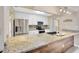 Modern kitchen featuring stainless steel appliances and light granite countertops at 11291 Countrywood Ct, Spring Hill, FL 34609