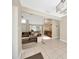 Spacious living room with hardwood floors connected to dining room and kitchen at 11291 Countrywood Ct, Spring Hill, FL 34609