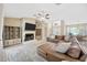 Inviting living room with a fireplace, built-in shelving, and a comfortable sectional sofa at 11291 Countrywood Ct, Spring Hill, FL 34609