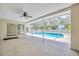 Large screened-in patio with views of the pool and spa at 11291 Countrywood Ct, Spring Hill, FL 34609