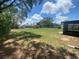 Expansive backyard with mature trees and full fence, offering endless possibilities for outdoor enjoyment at 11392 Beechdale Ave, Spring Hill, FL 34608