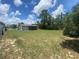 This large backyard features mature trees and a fenced yard at 11392 Beechdale Ave, Spring Hill, FL 34608