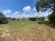 Beautifully large backyard, featuring privacy fence, ample space and mature trees at 11392 Beechdale Ave, Spring Hill, FL 34608