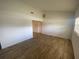 Vaulted ceiling bedroom with natural light and wood-look flooring at 11392 Beechdale Ave, Spring Hill, FL 34608