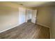 A clean bedroom with new wood-look flooring, fresh paint, and ample closet space at 11392 Beechdale Ave, Spring Hill, FL 34608