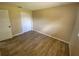A well-kept bedroom with wood-look floors and a spacious closet at 11392 Beechdale Ave, Spring Hill, FL 34608