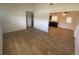 Open-concept living space with wood-look flooring, connecting seamlessly to the kitchen at 11392 Beechdale Ave, Spring Hill, FL 34608
