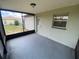Cozy screened-in porch features neutral paint, an outdoor view and easy access to the backyard and house at 11392 Beechdale Ave, Spring Hill, FL 34608
