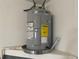 New energy-efficient AO Smith water heater installed on a sturdy shelf, ensuring reliable hot water at 11392 Beechdale Ave, Spring Hill, FL 34608