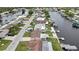 Aerial view of waterfront homes with well-maintained landscaping and private docks at 12637 2Nd Isle, Hudson, FL 34667