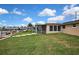 Spacious backyard with a view of the waterfront and mature landscaping at 12637 2Nd Isle, Hudson, FL 34667