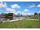 View of backyard and dock on the canal at 12637 2Nd Isle, Hudson, FL 34667