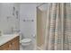 Cozy bathroom with a shower, single vanity, and seahorse wall decorations at 12637 2Nd Isle, Hudson, FL 34667