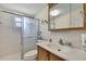 Bathroom with a vanity, toilet, and sliding glass shower door at 12637 2Nd Isle, Hudson, FL 34667