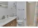 Cozy bathroom with a shower, single vanity, and seahorse wall decorations at 12637 2Nd Isle, Hudson, FL 34667