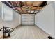 Spacious garage with unfinished ceiling, new flooring, and ample room for parking and storage at 12637 2Nd Isle, Hudson, FL 34667